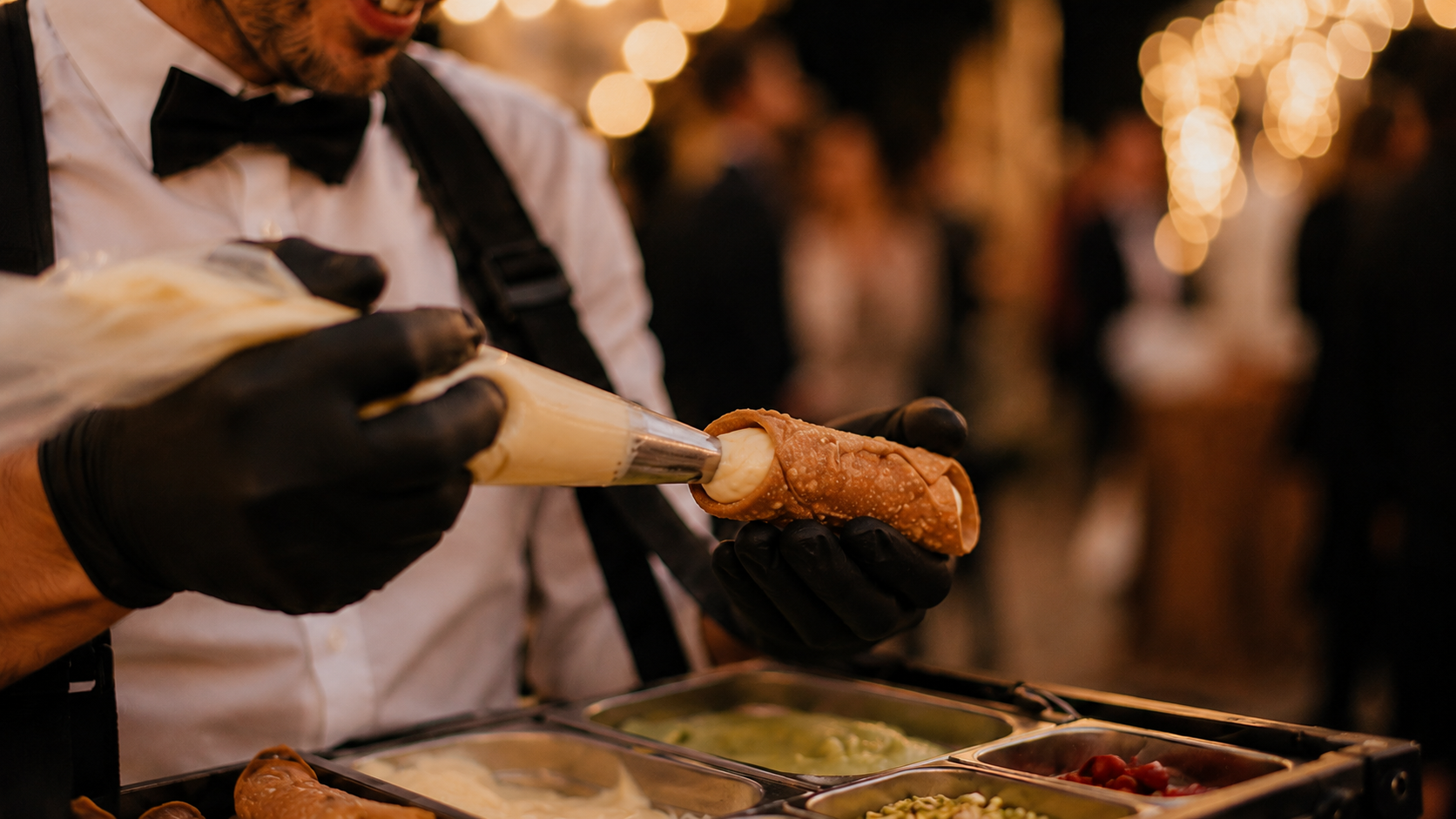 Cannoli filled live on the wearable serving tray